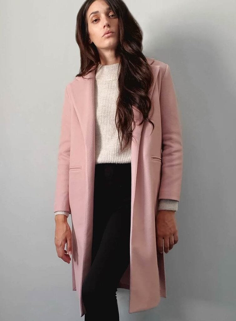 A smart and slim fitted, mid-length vegan coat